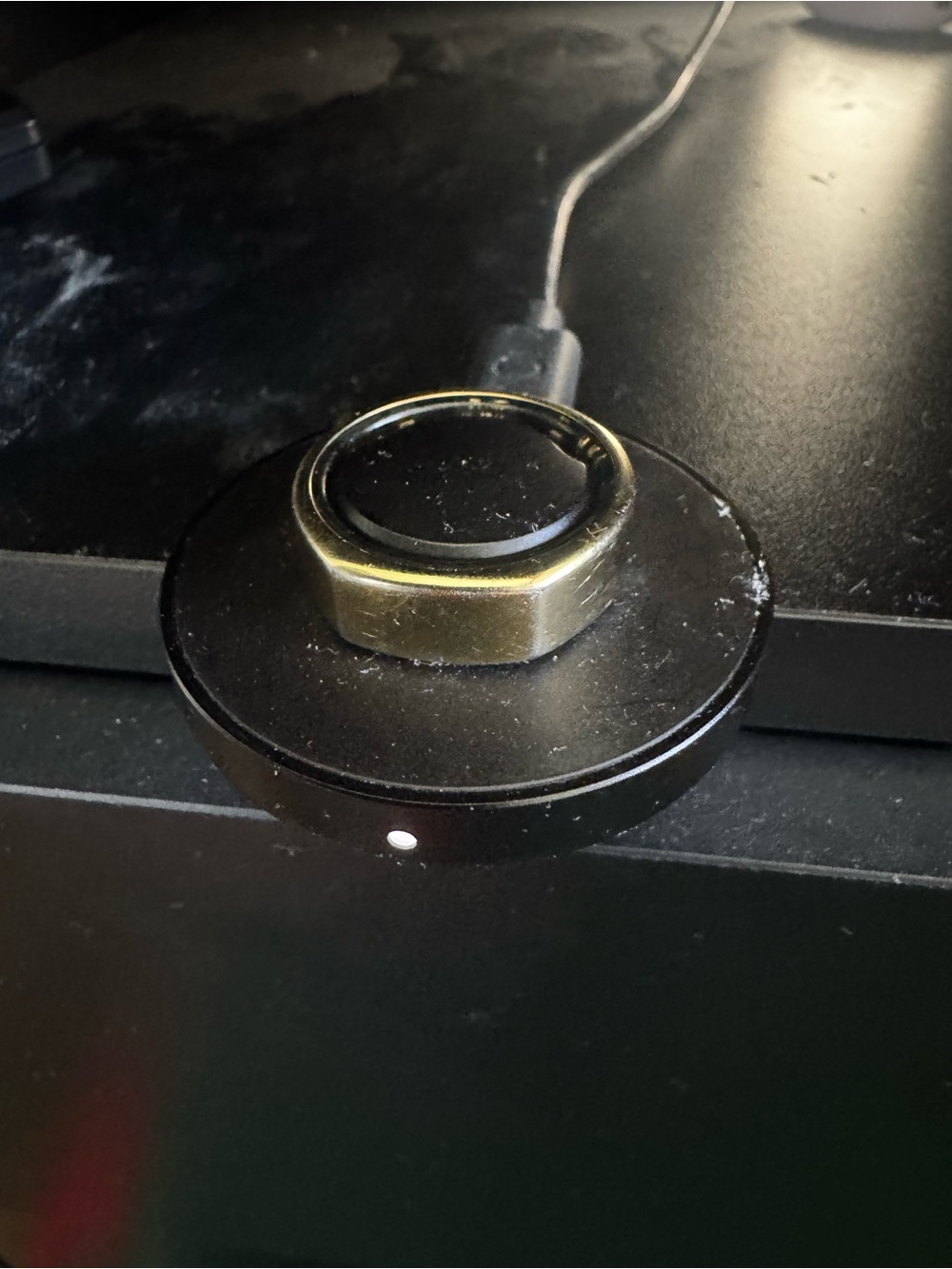 Oura Black Charging Dock with Gold Accent Ring